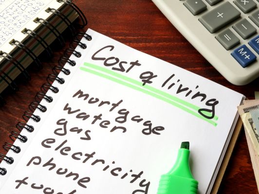 How is the cost of living measured in the UK